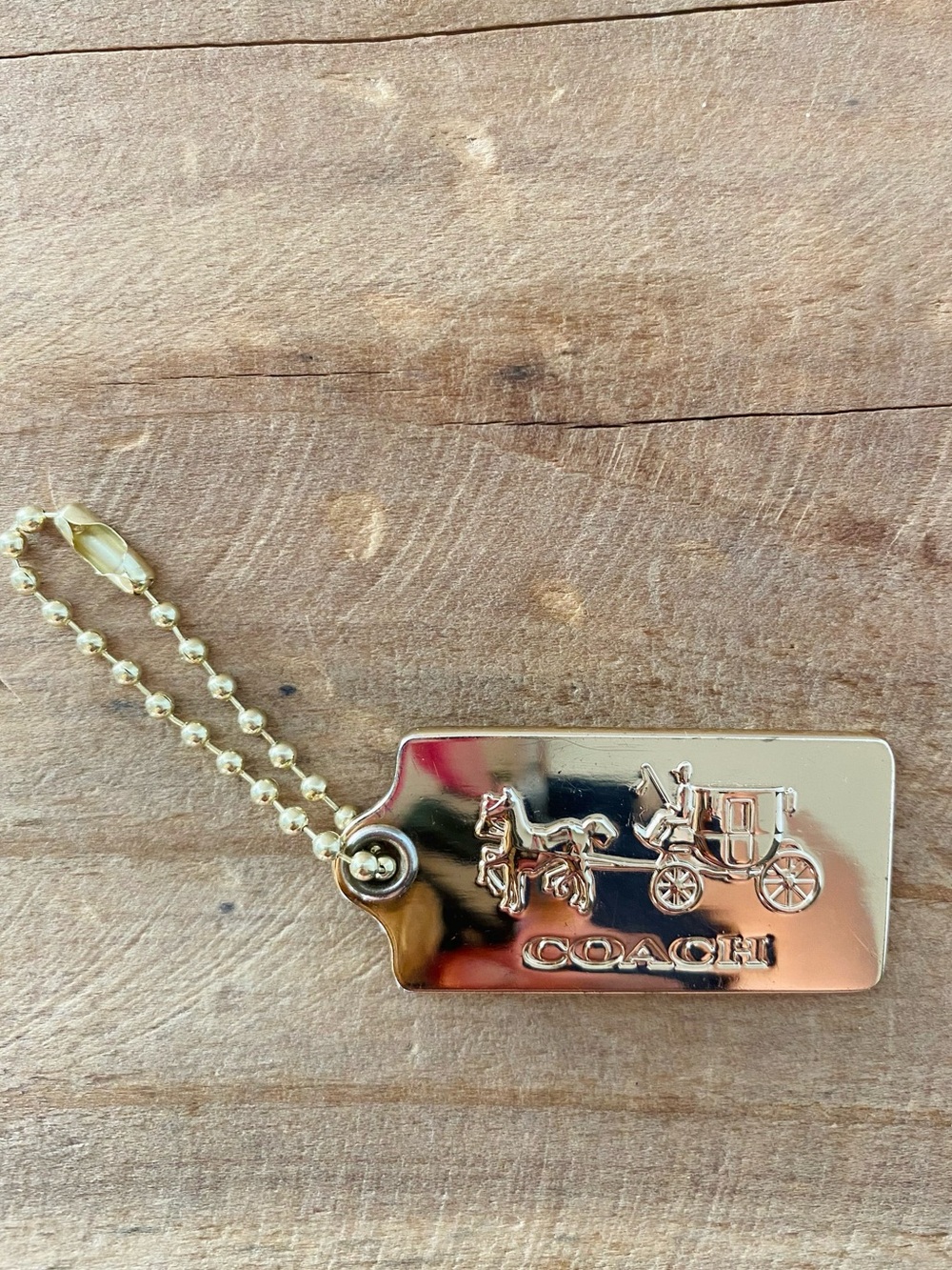 Coach Horse & Carriage hangtag- gold tone